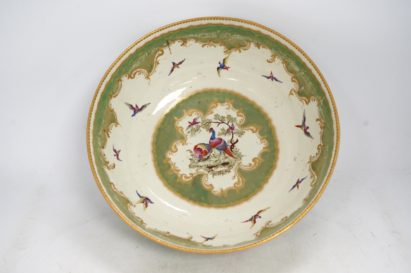 A large Worcester 'Fantastic Birds' bowl, c.1780, 28cm diameter. Condition - good, would benefit from a clean